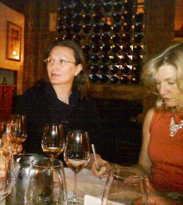 Rosaria and Melanie at the wine tasting event: listening, learning, and taking notes